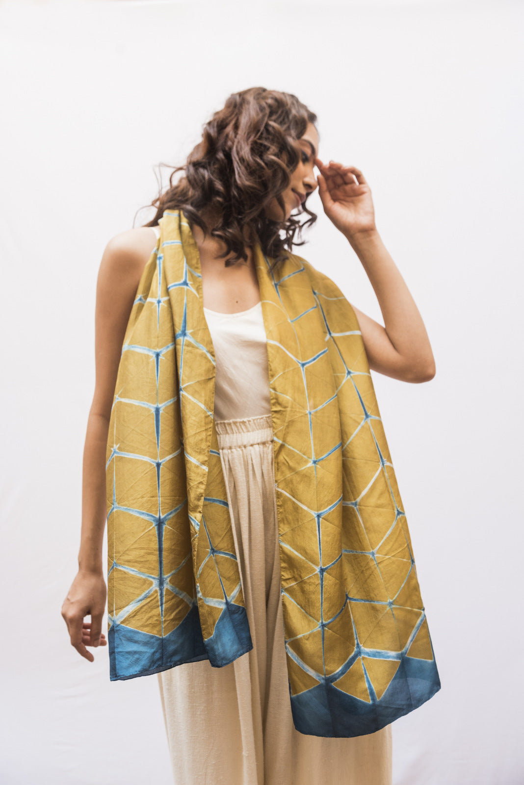 Woman wearing a silk shibori scarf