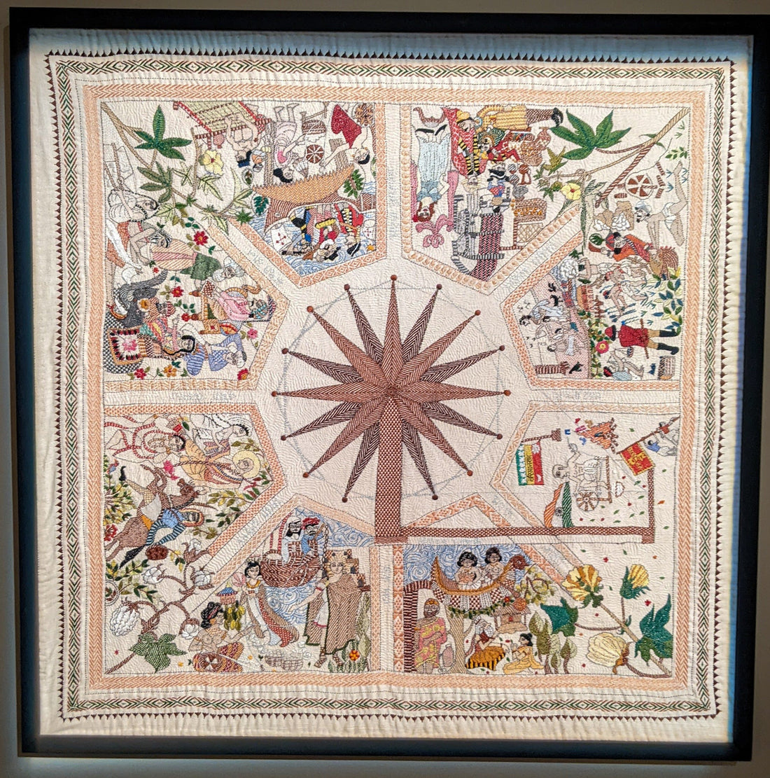 Traditional nakshi kantha wall art with spinning wheel motif