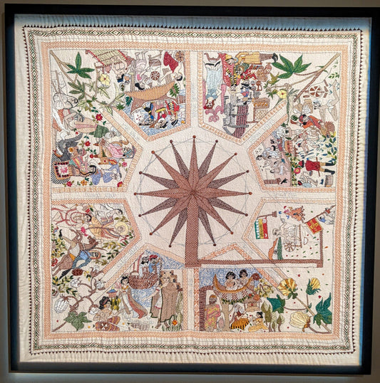 Traditional nakshi kantha wall art with spinning wheel motif