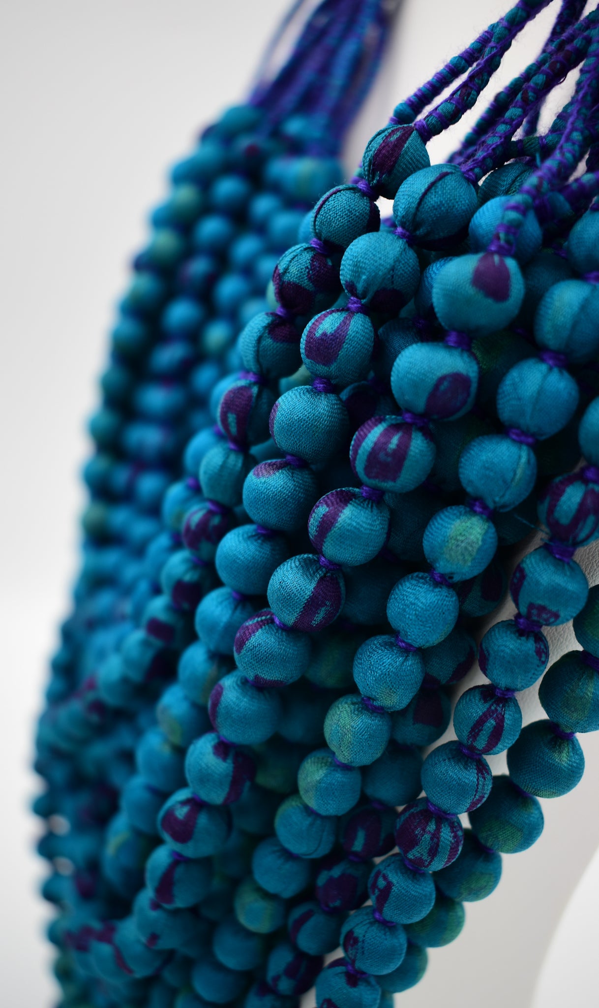 Peacock — Sari Silk Bead Necklace, 22-String — Teal and Purple — detail of beads