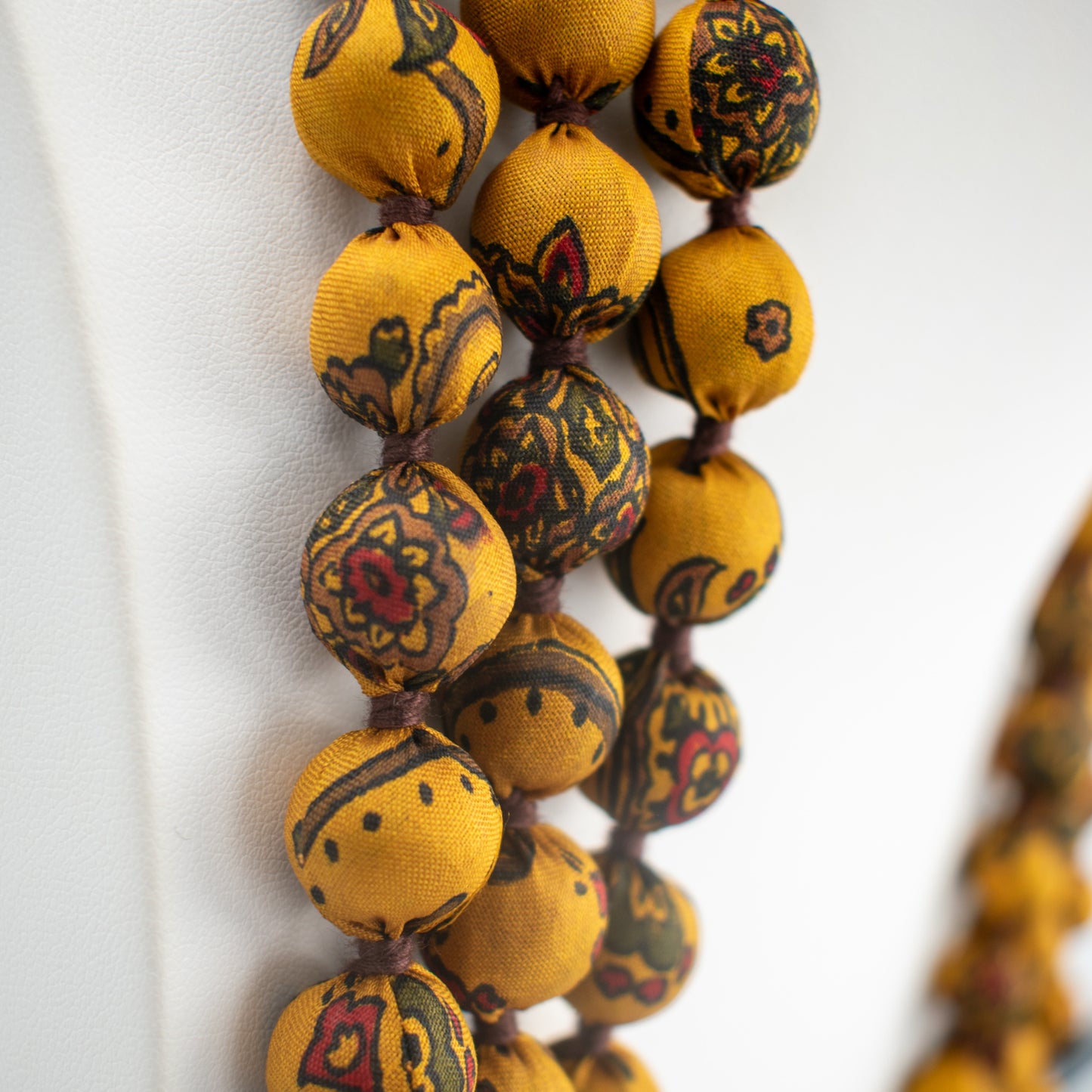Sari Silk Bead Necklace, 3-String — Mustard and Brown — worn on neck