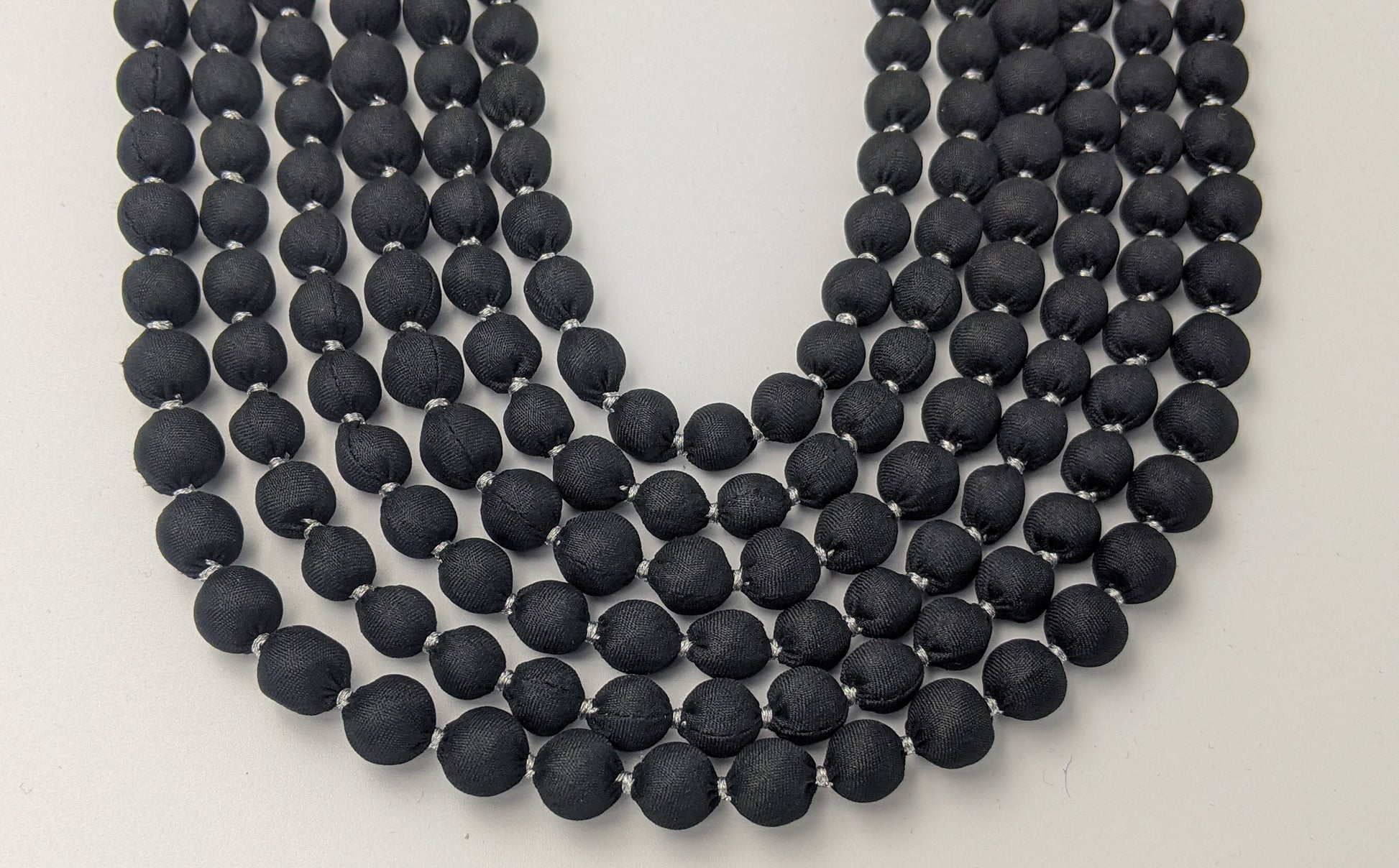 Sari Silk Bead Necklace, 6-String — Black and Silver — worn on neck